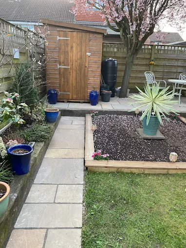 Garden patio with timber raised beds and planting